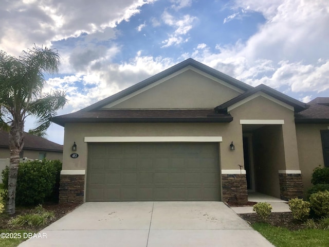 453 Tuscany Chase Dr, Daytona Beach, FL 32117 - view of front facade featuring driveway, stone siding, and stucco siding