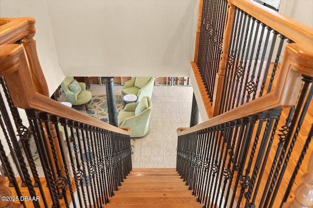 stairway with wood-type flooring