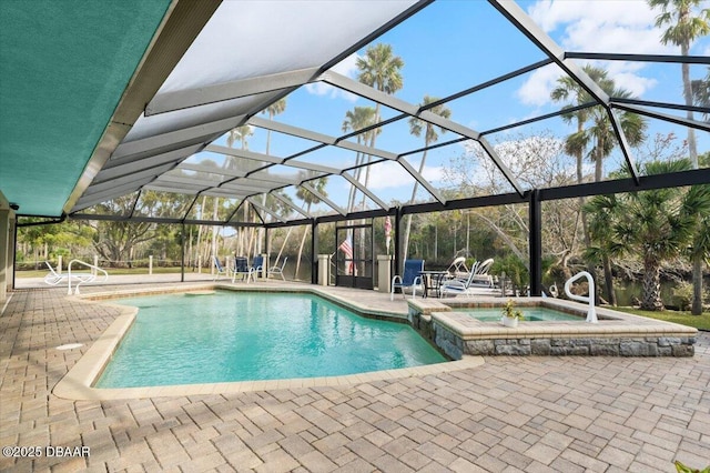 view of swimming pool featuring an in ground hot tub, a lanai, and a patio