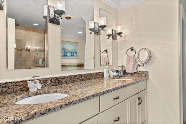 bathroom featuring ornamental molding and vanity