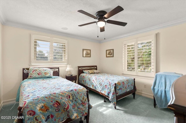 carpeted bedroom featuring ceiling fan, ornamental molding, and a textured ceiling