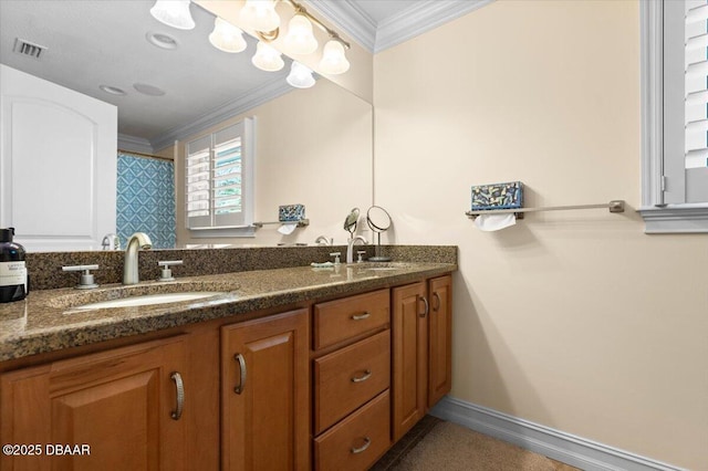 bathroom with ornamental molding and vanity