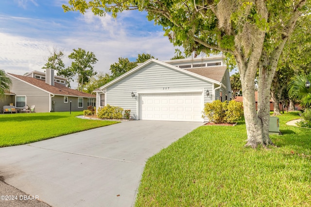 front of property featuring a garage and a front lawn