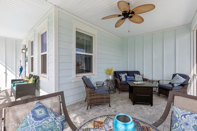 exterior space with ceiling fan and an outdoor hangout area