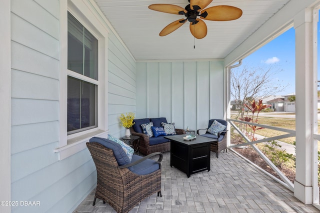 sunroom / solarium with ceiling fan