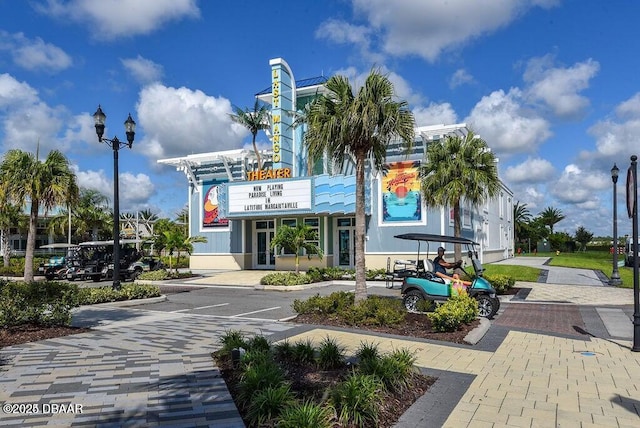 view of building exterior featuring uncovered parking