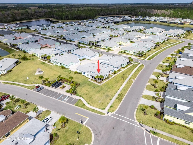 aerial view with a water view and a residential view