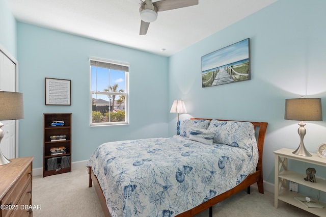 bedroom with carpet floors, a ceiling fan, and baseboards