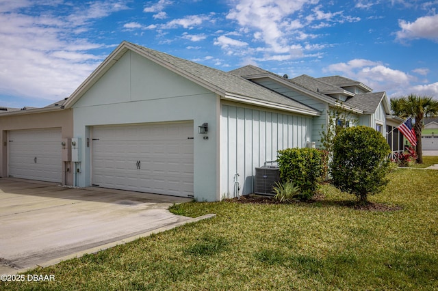 view of home's exterior with a garage, a lawn, concrete driveway, central AC, and stucco siding