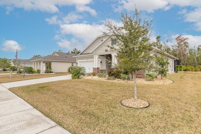 view of front of property featuring a garage and a front yard