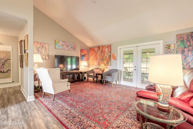 living room featuring high vaulted ceiling, hardwood / wood-style floors, and french doors