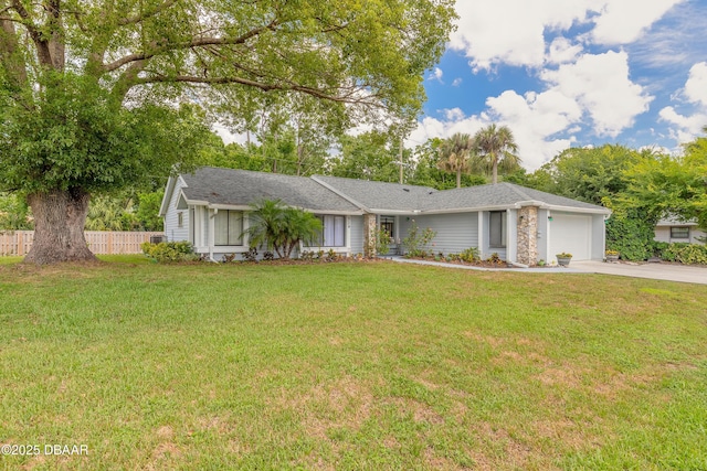 single story home with a front lawn and a garage