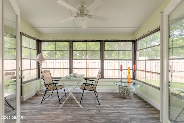 sunroom featuring ceiling fan and lofted ceiling