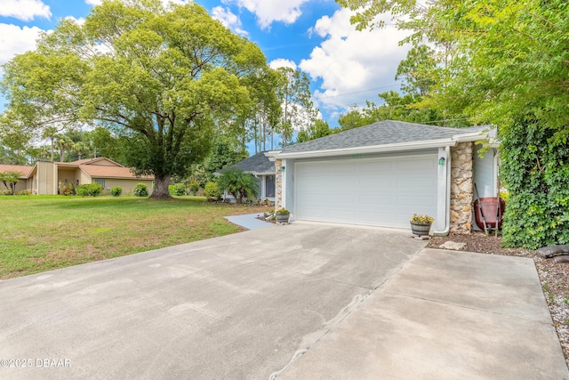 view of front facade with a garage and a front yard