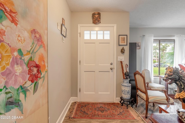 foyer with a textured ceiling