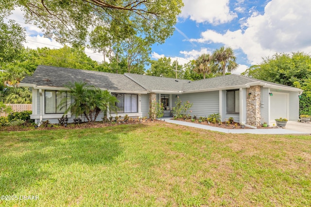 ranch-style home featuring a front yard and a garage