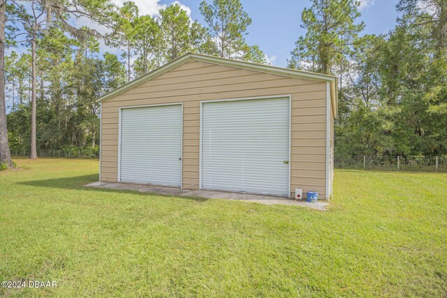 garage with a lawn