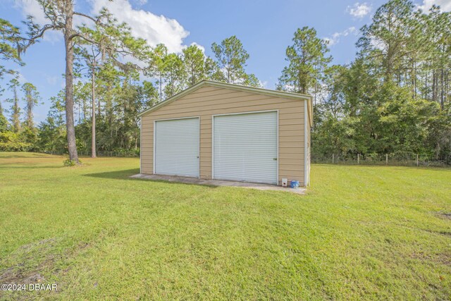 garage with a lawn