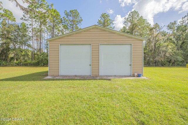 garage with a yard