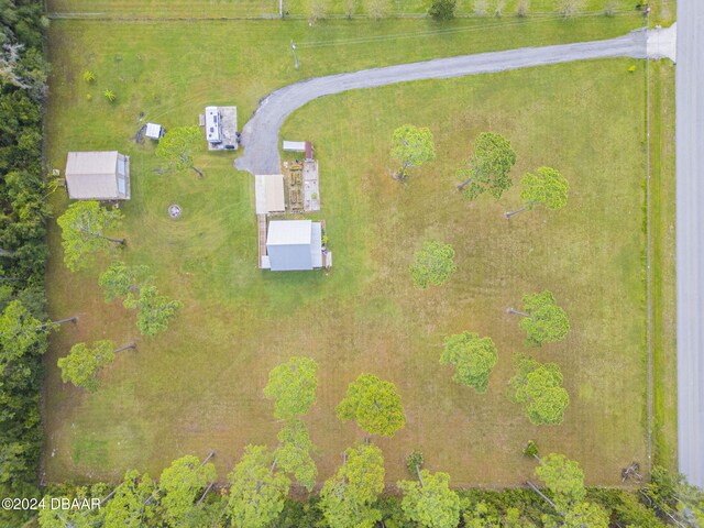 birds eye view of property with a rural view