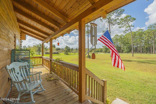 wooden deck with a yard