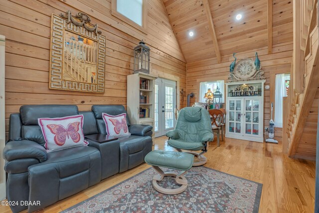 living room featuring french doors, plenty of natural light, hardwood / wood-style flooring, and high vaulted ceiling