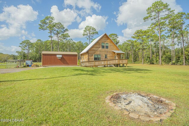 exterior space with a lawn and a deck