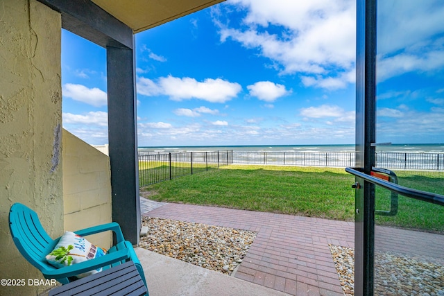 2301 S Atlantic Ave Unit 132, Daytona Beach, FL 32118 - view of patio with a view of the beach, a water view, and a fenced backyard