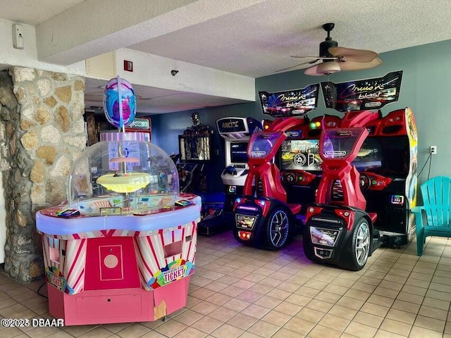 2301 S Atlantic Ave Unit 132, Daytona Beach, FL 32118 - game room with light tile patterned floors, ceiling fan, and a textured ceiling