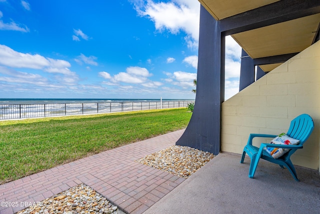 2301 S Atlantic Ave Unit 132, Daytona Beach, FL 32118 - view of patio / terrace featuring fence private yard, a water view, and a beach view