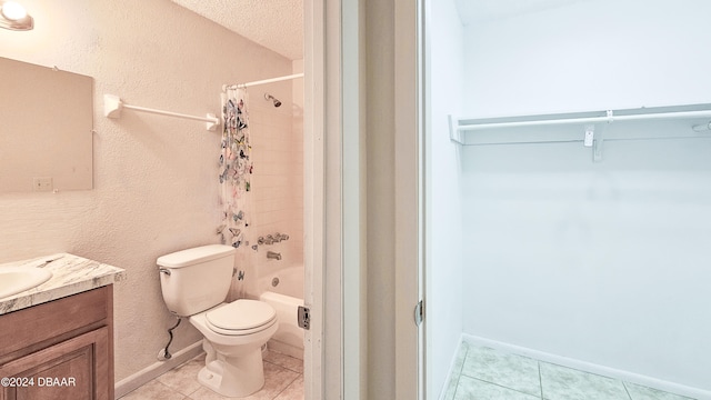 full bathroom with vanity, a textured ceiling, tile patterned floors, and toilet