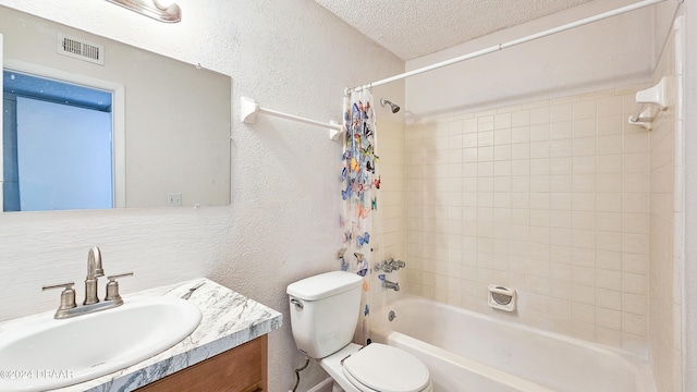 full bathroom featuring vanity, a textured ceiling, shower / bath combo, and toilet