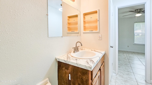 bathroom with ceiling fan, vanity, and tile patterned floors