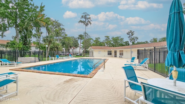 view of swimming pool featuring a patio