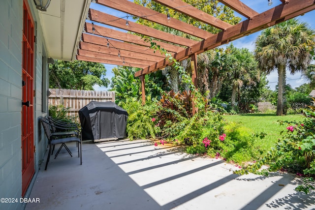 view of patio featuring a grill and a pergola