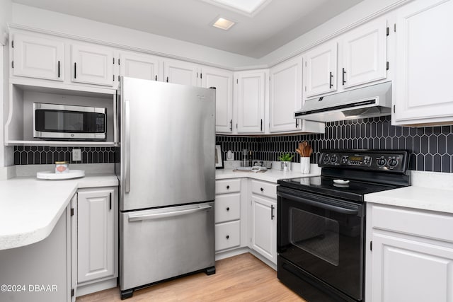 kitchen with white cabinetry, appliances with stainless steel finishes, and backsplash