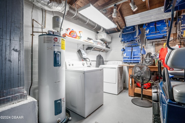 washroom with electric water heater and washing machine and clothes dryer