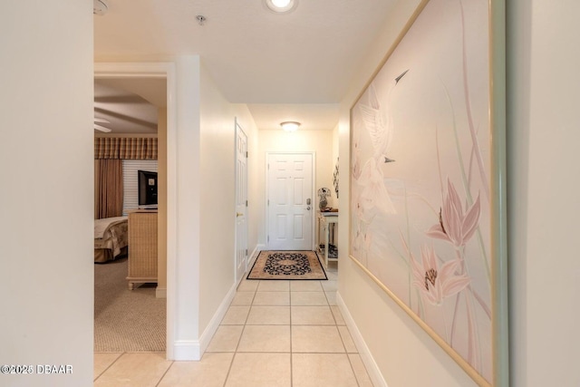 hallway featuring light tile patterned floors