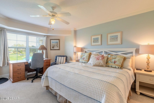 carpeted bedroom with ornamental molding and ceiling fan