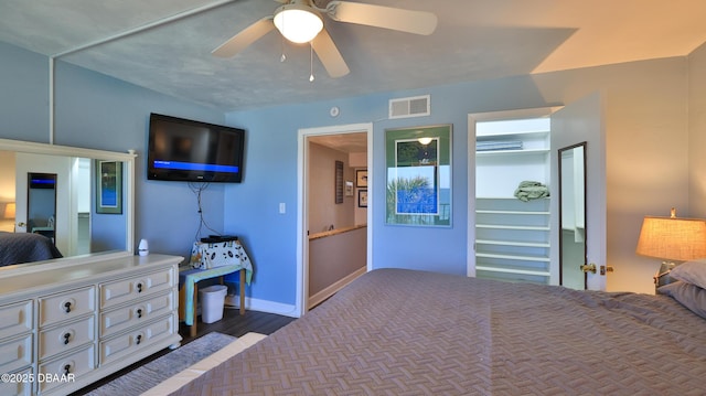 bedroom with ceiling fan and dark wood-type flooring