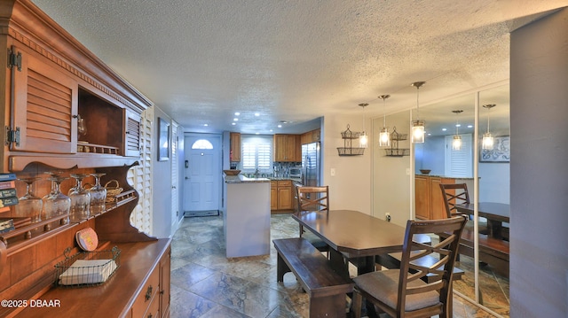 dining room with a textured ceiling