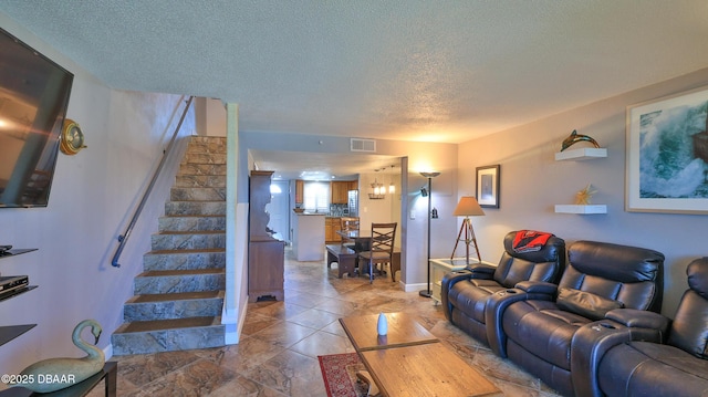 living room with a textured ceiling