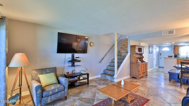 living room featuring a textured ceiling