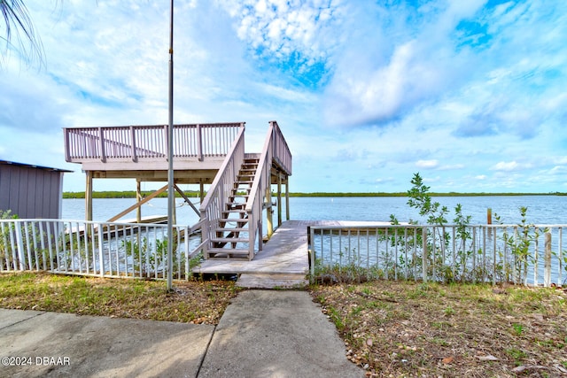 view of dock with a deck with water view