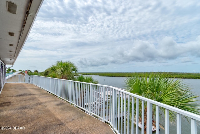 balcony featuring a water view