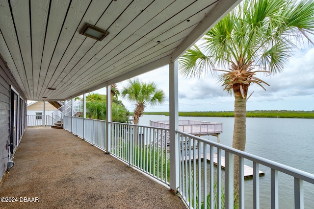 balcony featuring a water view