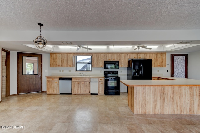 kitchen with black appliances, sink, a wealth of natural light, and decorative light fixtures