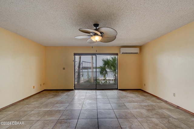 empty room featuring ceiling fan, a textured ceiling, light tile patterned floors, and a wall mounted AC