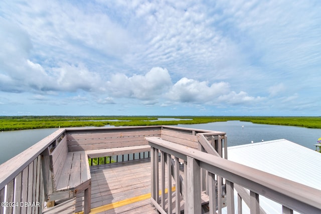 deck featuring a water view