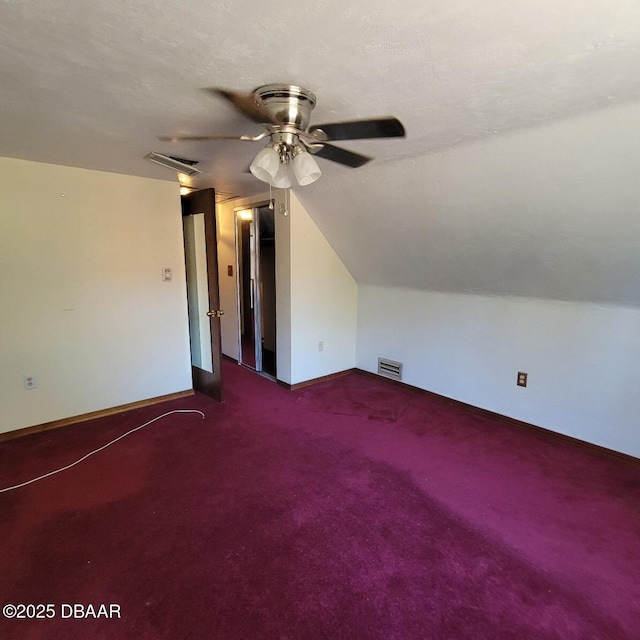 additional living space featuring visible vents, baseboards, and ceiling fan